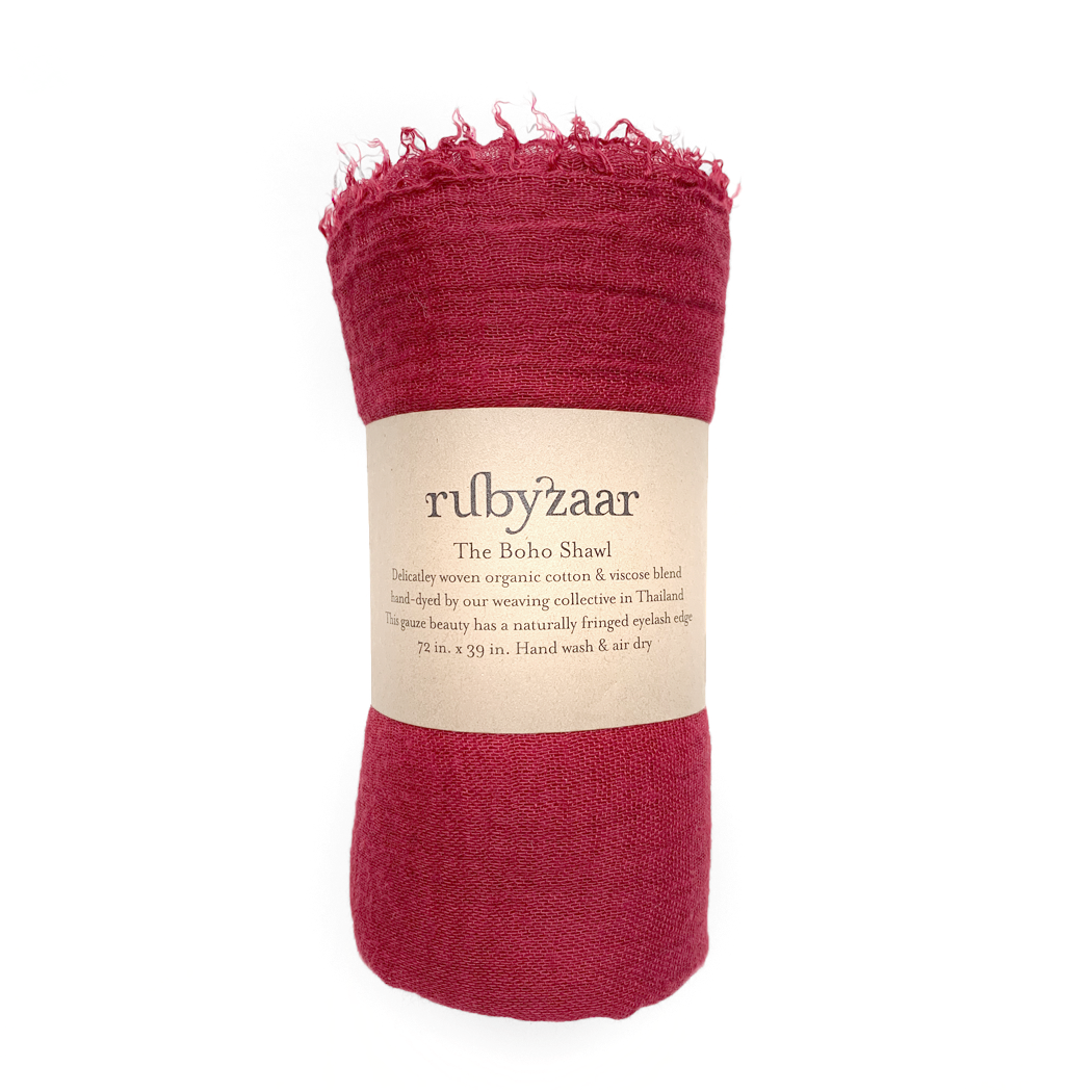 Red shawl with a visible brand label on a white background