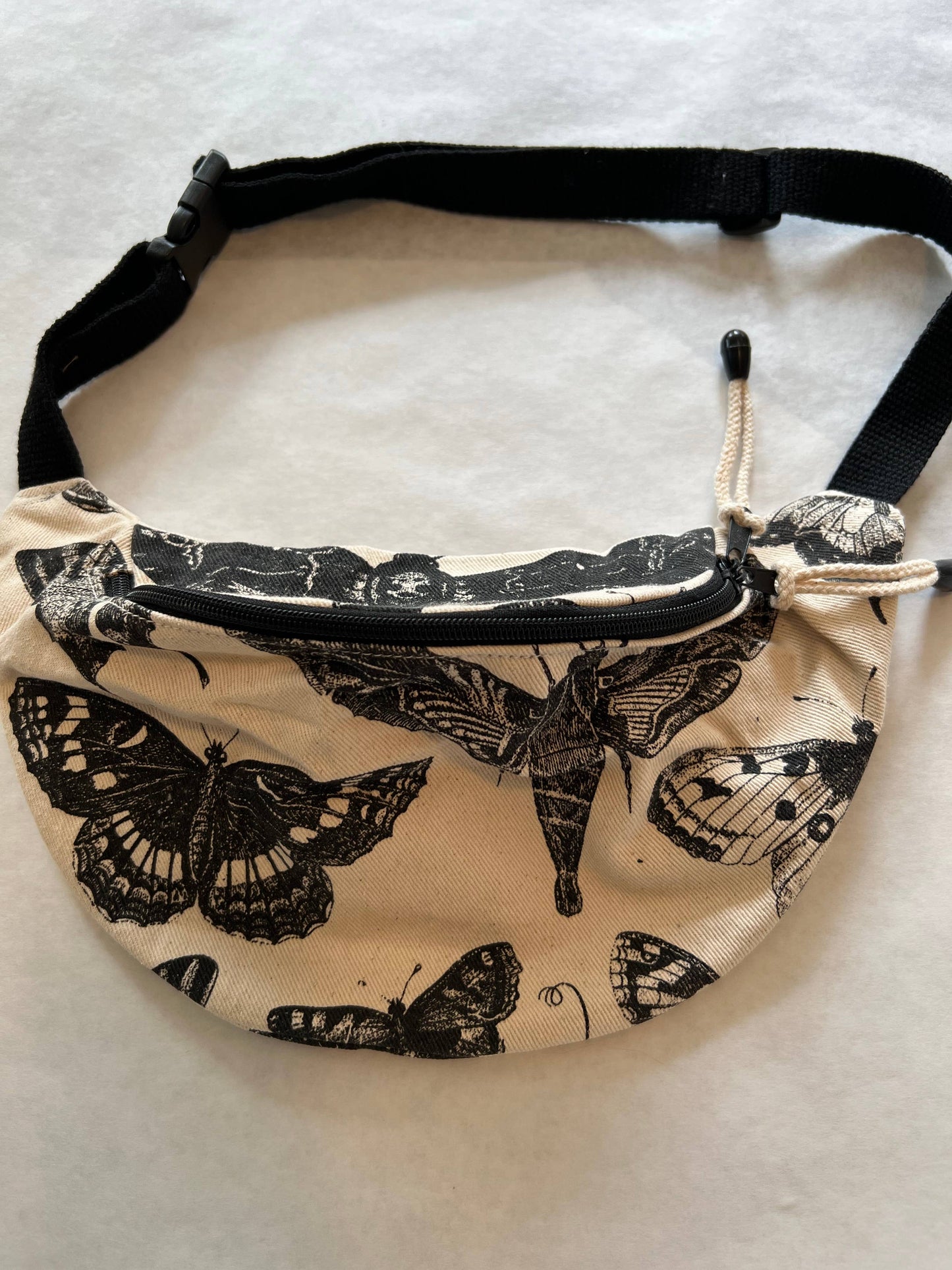 Fanny pack with butterfly pattern on a white background
