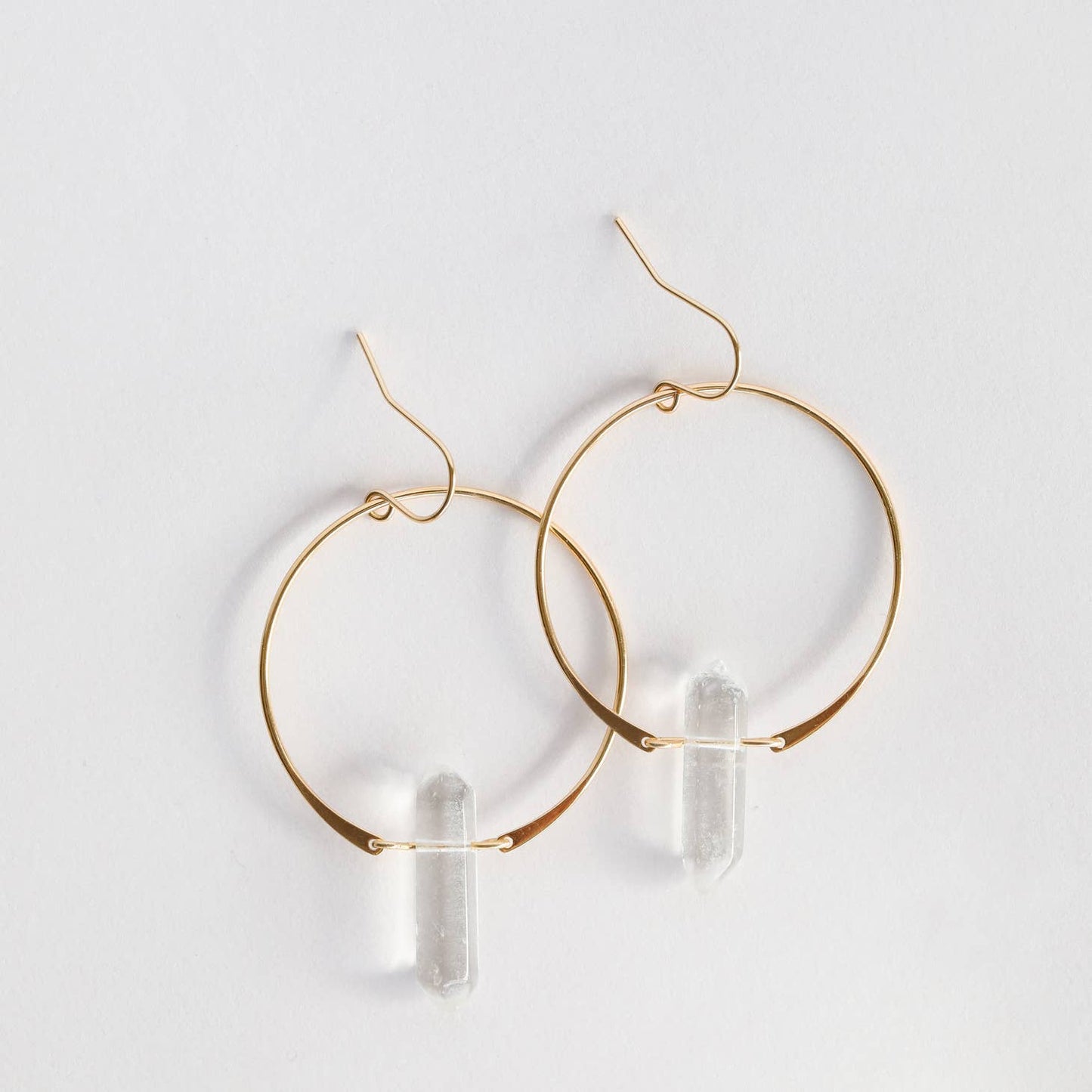 JAXKELLY CLEAR QUARTZ HOOPS