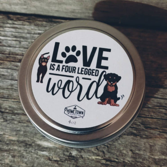 HOMETOWN CANDLES "LOVE IS A FOUR LEGGED WORD" DOG CANDLE 4 OUNCE TIN